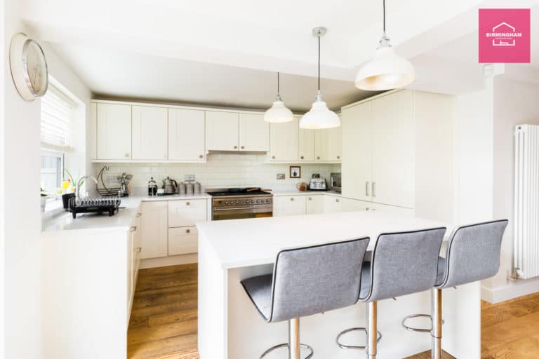 Spacious kitchen area in a Birmingham house, featuring sleek design and ample seating, ideal for contractors seeking comfortable beds for builders.